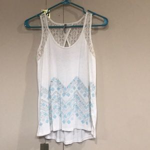 Tank-top with chevron print at bottom.
